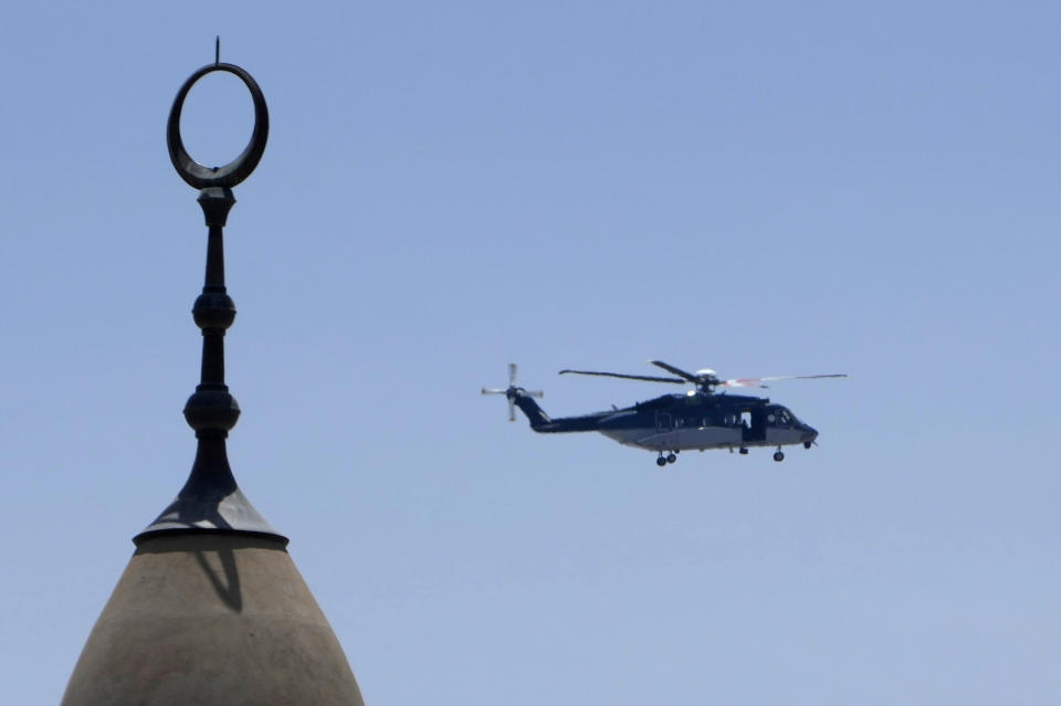 A Saudi police helicopter patrols over Namira Mosque in Arafat, on the second day of the annual hajj pilgrimage, near the holy city of Mecca, Saudi Arabia, Friday, July 8, 2022. Hundreds of thousands of Muslim pilgrims from around the world raised their hands to heaven and offered prayers of repentance on the sacred hill of Mount Arafat in Saudi Arabia on Friday, an intense day of worship considered to be the climax of the annual Hajj. (AP Photo/Amr Nabil)