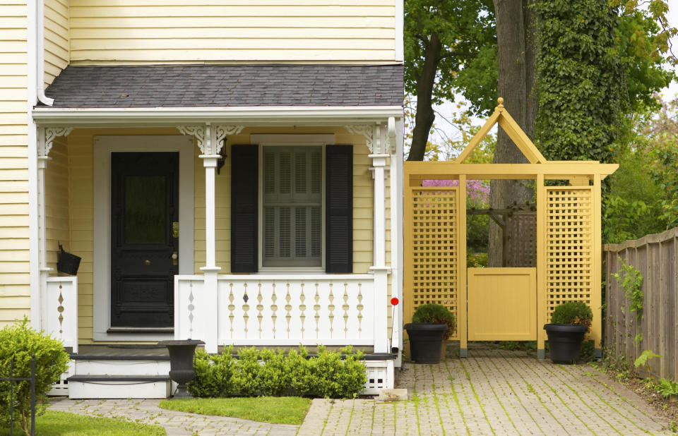 A front door with accent colored exterior wall