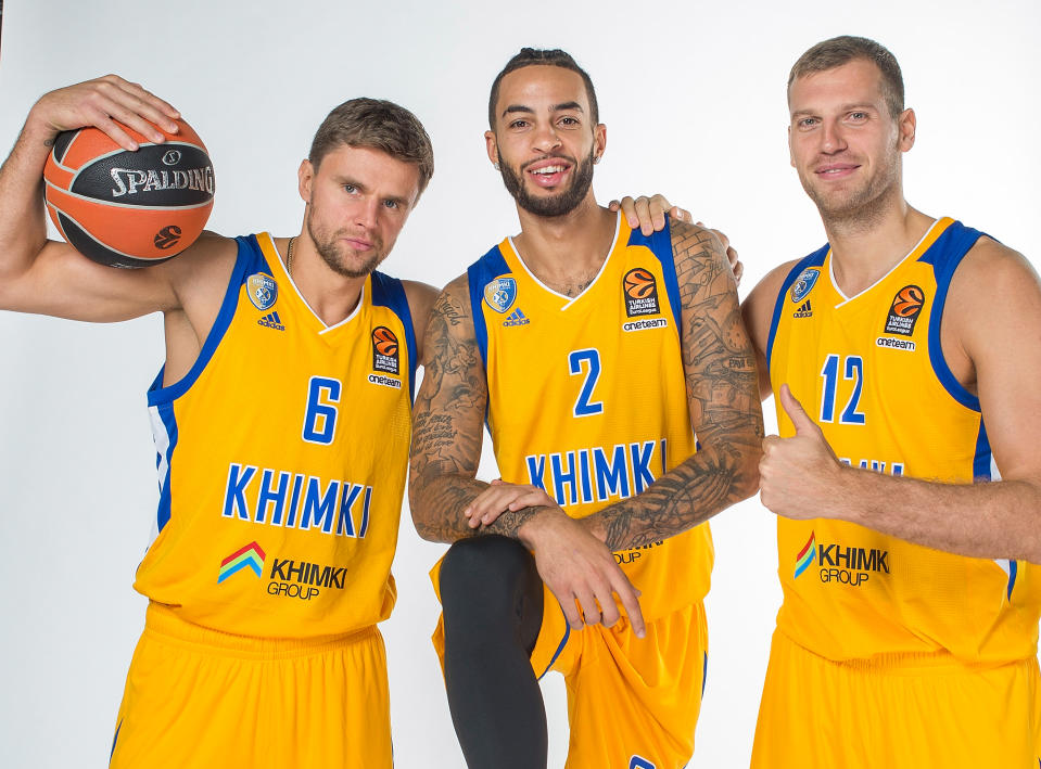 Tyler Honeycutt poses with two BC Khimki teammates last September in Moscow. (Getty Images)