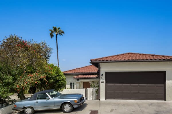 Perched high in the Los Feliz neighborhood, the Spanish-style bungalow offers striking views of the surrounding canyons, as well as Griffith Park and the Observatory.