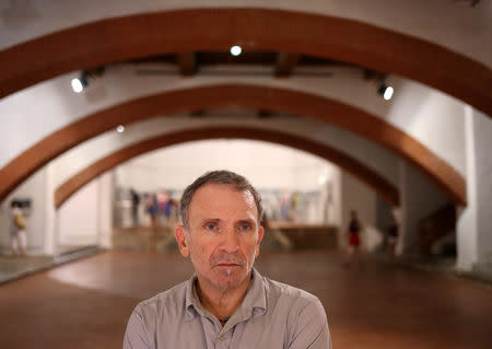 FILE PHOTO: Pulitzer Prize winning photojournalist Yannis Behrakis stands for a portrait during an exhibit at the Visa pour l'Image photo festival in Perpignan, France, August 31, 2016. REUTERS/Adrees Latif/File photo