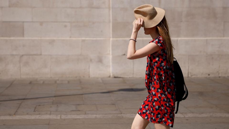 woman protecting herself from the sun