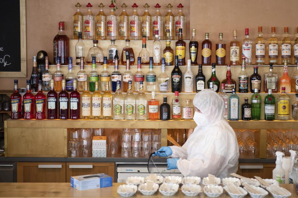 Antje, employee at Café Rauschenbach, prepares a Corona quick test at Cafe Rauschenbach in Dresden, Germany, Monday, April 19, 2021. The restaurant offers a rapid antigen test on its premises. (Sebastian Kahnert/dpa via AP)