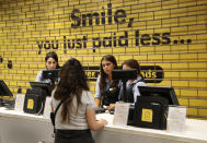 A customer asks employees if she can still enter an international fashion and homeware retailer that will temporarily shut down from Friday in the face of an increasingly volatile currency market and their inability to set prices while the Lebanese pound plunges against the dollar, in Beirut, Lebanon, Thursday July 2, 2020. Later in the day, owners of the businesses rallied in central Beirut to denounce the government's inability to handle a deepening economic and financial crisis, and urging others to join them after the Lebanese pound recorded a new low Thursday, selling at nearly 10,000 for a dollar and maintaining the downward slide that saw the national currency lose about 85% of its value over the past months. (AP Photo/Hussein Malla)