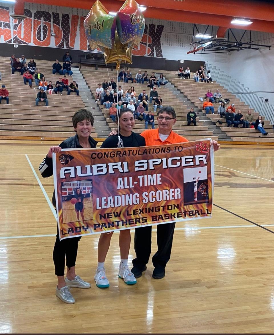 New Lexington's Aubri Spicer was honored during Saturday's game at Meadowbrook, as she became the school's all-time leading scorer. She finished with 16 points in the 60-52 victory.