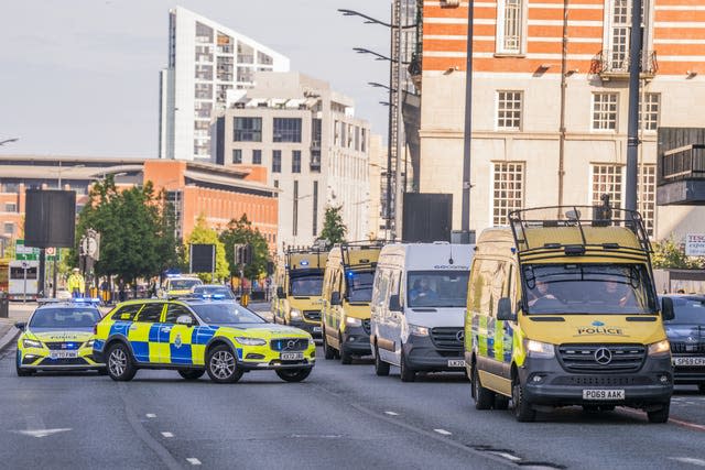 Prison van surrounded by police vehicles