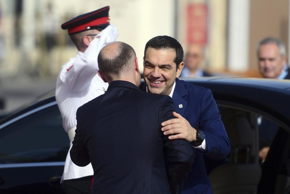 Greece Prime Minister Alexis Tsipras, right, is welcomed by Malta Prime Minister Joseph Muscat on the occasion of the Mediterranean Summit of Southern EU countries in Valetta, Malta, Friday, June 14, 2019. (AP Photo/Jonathan Borg)