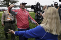 Gary Woodland celebrates after winning the U.S. Open Championship golf tournament with his mother Linda, Sunday, June 16, 2019, in Pebble Beach, Calif. (AP Photo/Carolyn Kaster)