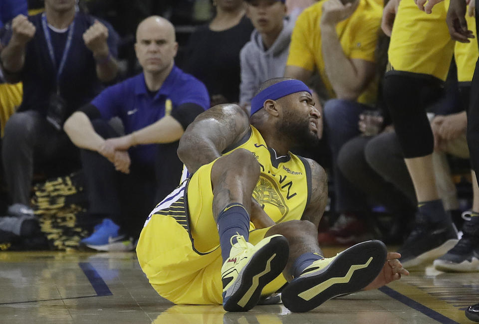 Golden State Warriors center DeMarcus Cousins reacts after falling to the floor during the first half of Game 2 of a first-round NBA basketball playoff series against the Los Angeles Clippers in Oakland, Calif., Monday, April 15, 2019.