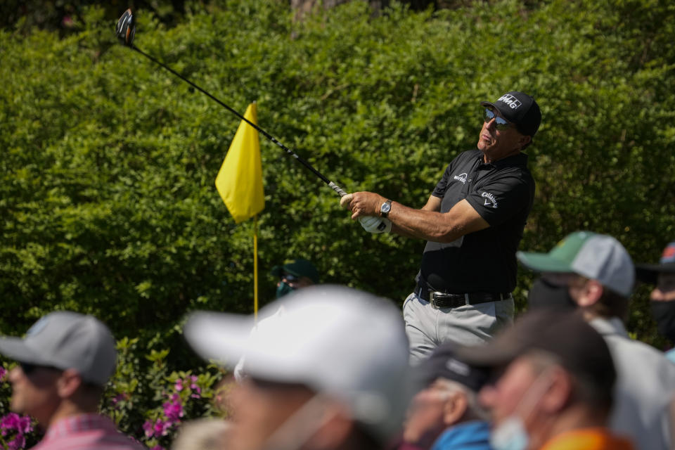 Phil Mickelson watches his tee shot on the 14th hole during a practice round for the Masters golf tournament on Tuesday, April 6, 2021, in Augusta, Ga. (AP Photo/David J. Phillip)