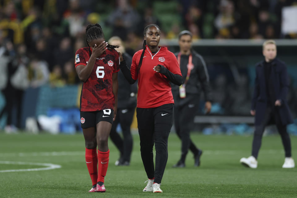 Canada's Deanne Rose, left, leaves the field a the end of the Women's World Cup Group B soccer match between Australia and Canada in Melbourne, Australia, Monday, July 31, 2023. Australia won 4-0. (AP Photo/Victoria Adkins)