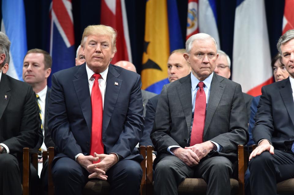 US President Donald Trump(L)sits with Attorney General Jeff Sessions on December 15, 2017 in Quantico, Virginia, before participating in the FBI National Academy graduation ceremony. | NICHOLAS KAMM—AFP/Getty Images