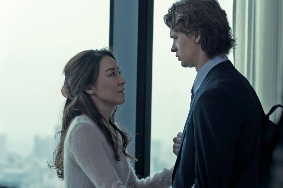 Ayumi Ito and Ansel Elgort look at each other in a still from 'Tokyo Vice'