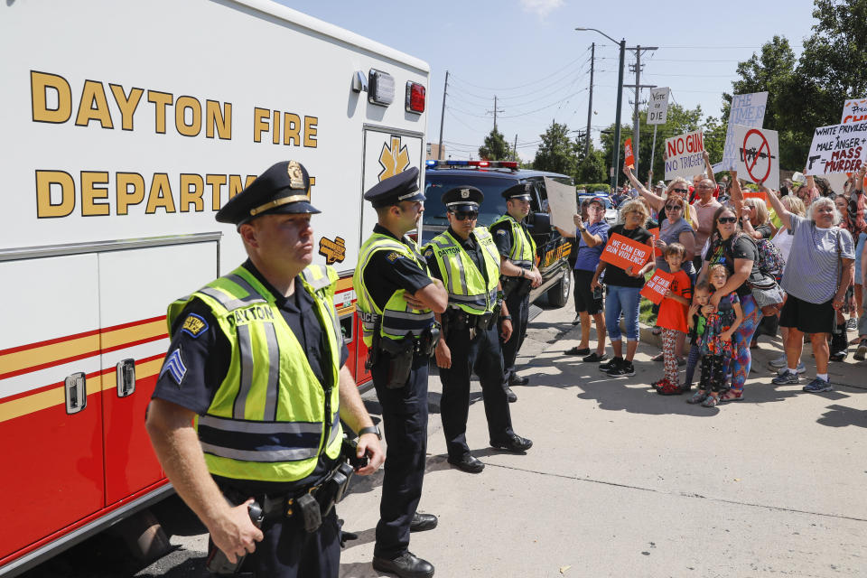 Police block the street as demonstrators protest the arrival of President Donald Trump outside Miami Valley Hospital after a mass shooting that occurred in the Oregon District early Sunday morning, Aug. 7, 2019, in Dayton. (Photo: John Minchillo/AP)