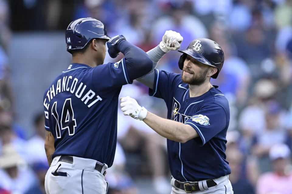 Tampa Bay Rays Christian Bethancourt (14) congratulates Brandon Lowe (8) after his two run home run in the seventh inning of a baseball game against the Chicago Cubs on Wednesday, May 31, 2023, in Chicago. (AP Photo/Quinn Harris)