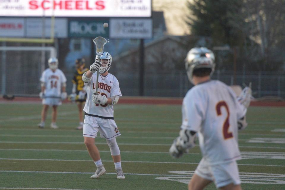 Poudre School District boys lacrosse player Austin Selvage receives a pass during a game against Thompson Valley on April 20 at French Field.