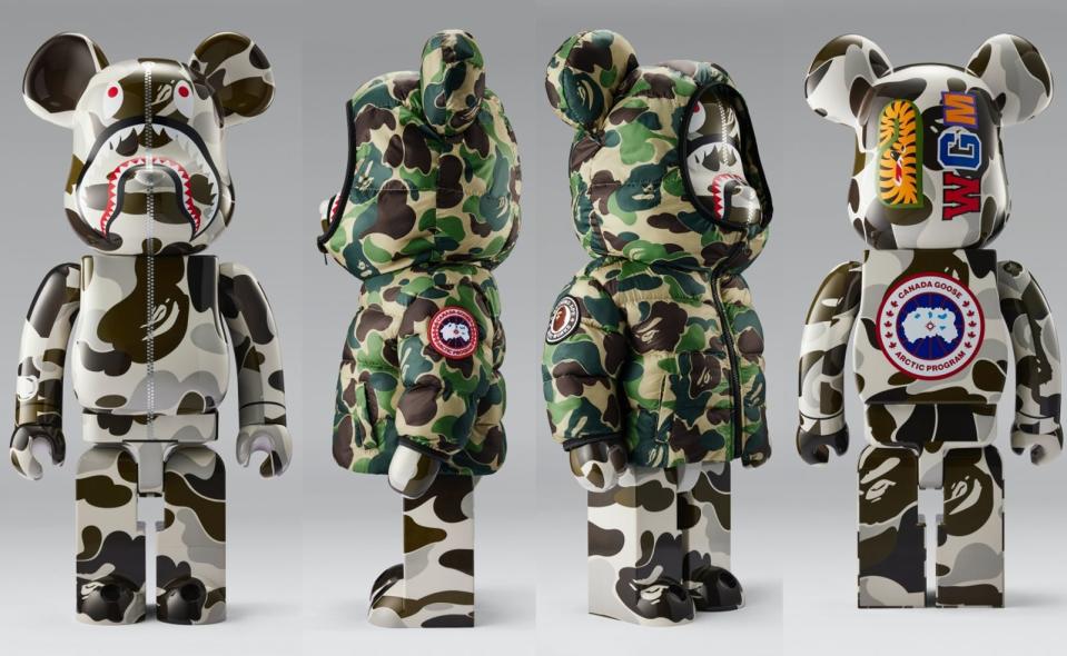 CANADA GOOSE X BAPE® BE@RBRICK聯名公仔，有可穿脫的客製化Crofton迷彩綠印花圖騰搭配CANADA GOOSE經典圓盤Logo羽絨外套。1000%公仔NT$47,439（CANADA GOOSE提供） 