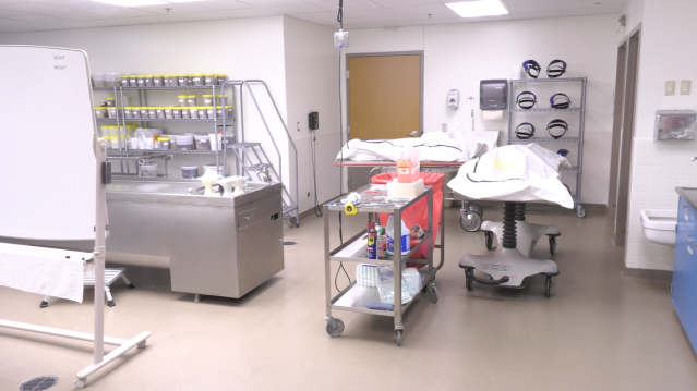 The morgue at the University of Kansas Health System has room for nine patients who have died. When those spaces are filled, extra carts and the autopsy and transport tables are used to hold the overflow, which has become more common since the start of the COVID-19 pandemic.