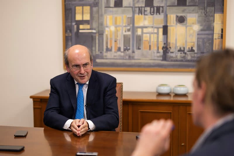 Greek Finance Minister Hatzidakis speaks during an interview with Reuters