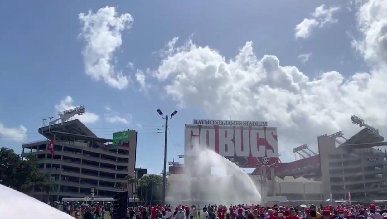 <p>Truck sprays water on the crowd as supporters wait in heat during Trump’s Tampa rally</p> (Screengrab/video)