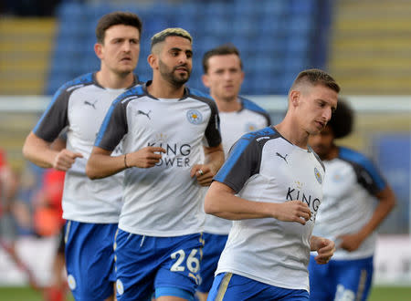 Soccer Football - Premier League - Leicester City vs Southampton - King Power Stadium, Leicester, Britain - April 19, 2018 (L - R) Leicester City's Harry Maguire, Riyad Mahrez and Marc Albrighton during the warm up before the match REUTERS/Peter Powell