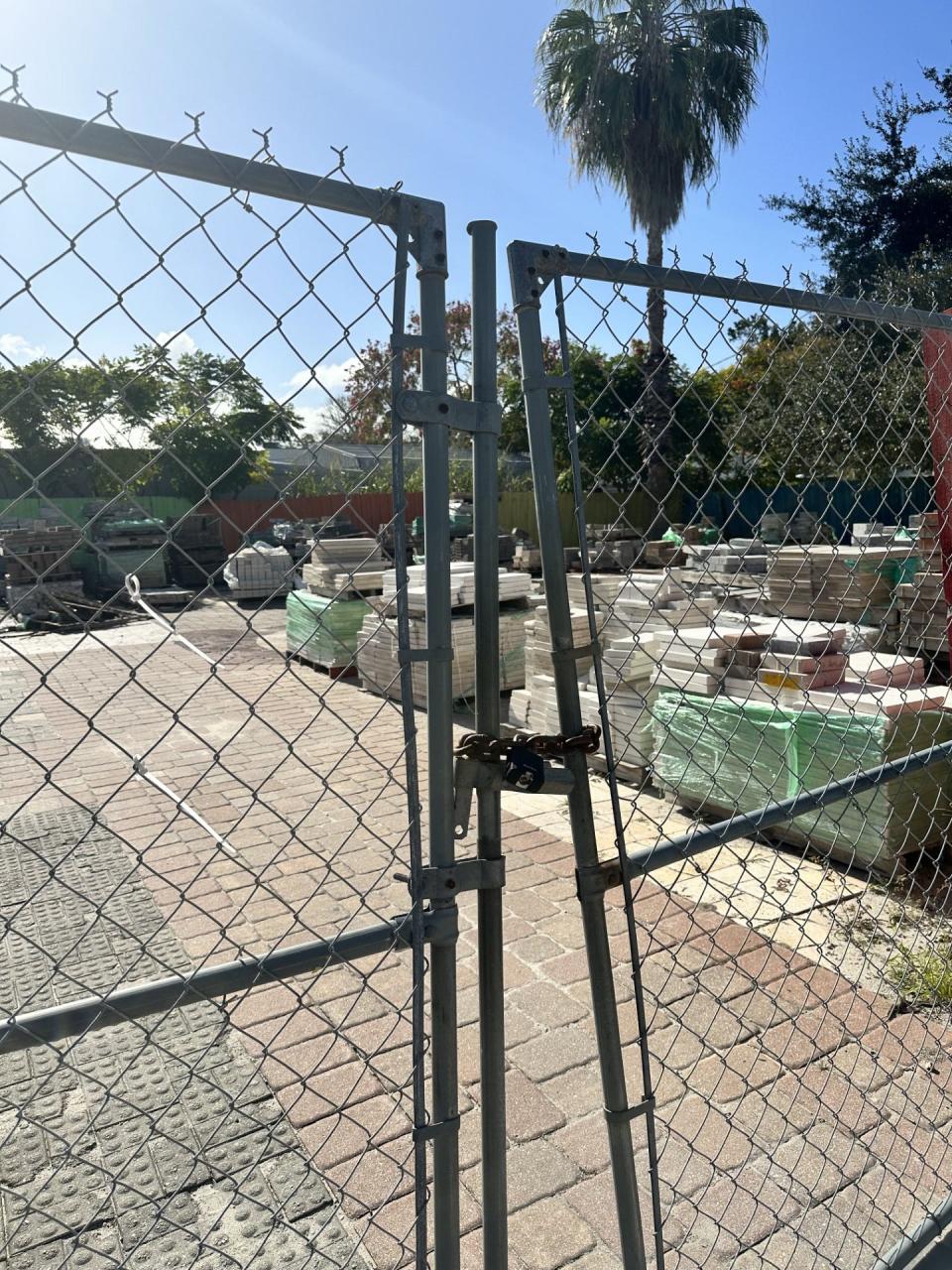 A locked gate encloses a yard full of supply at Serene Pavers & Stonescapes Inc., New Smyrna Beach. The business taped a sign to its doors announcing its closure on Oct. 17, before completing jobs for which it had taken thousands of dollars in deposits.