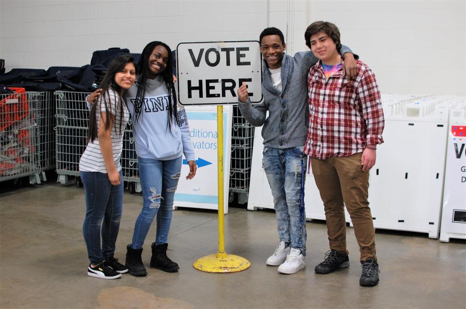 Students work at a polling place in Minneapolis.