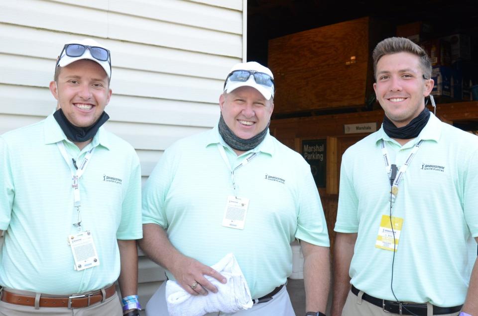 Mike Adolph, center, vice president of the Northern Ohio Golf Charities and Foundation, is shown with fellow Bridgestone Senior Players Championship volunteers Andrew Adolph, left, and Nicholas Adolph. The annual golf tournament is held at Firestone Country Club in Akron.