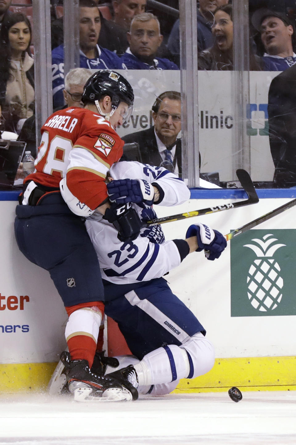 Florida Panthers center Aleksi Saarela (28) takes down Toronto Maple Leafs defenseman Travis Dermott (23) during the first period of an NHL hockey game Thursday, Feb. 27, 2020, in Sunrise, Fla. (AP Photo/Wilfredo Lee)