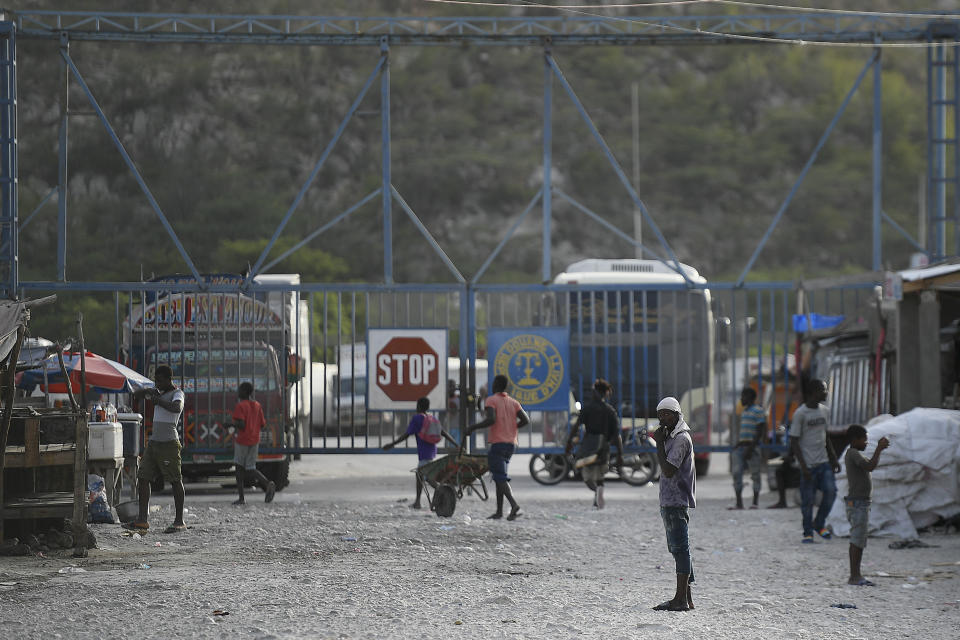 The entrance gate to Haiti is closed seen from Jimani, Dominican Republic, Thursday, July 8, 2021. Dominican President Luís Abinader ordered the closure of the border on Wednesday, after Haiti's government reported that a team of gunmen had assassinated President Jovenel Moïse. (AP Photo/Matias Delacroix)