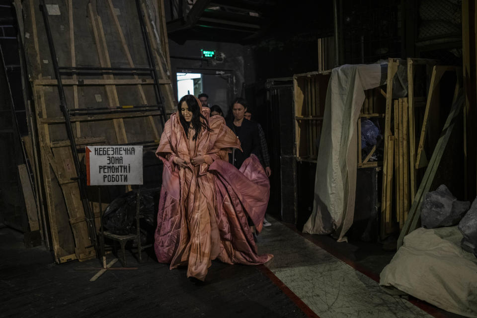 Ukrainian singer Jamala walks backstage before performing a concert at the National Opera in central Kyiv on Friday, May 5, 2023. Jamala won the Eurovision Song Contest in 2016 with a song about the deportation of Crimean Tatars. Fast forward to this Eurovision week and she's launching a new album, filled with more stories about her ancestors. (AP Photo/Bernat Armangue)