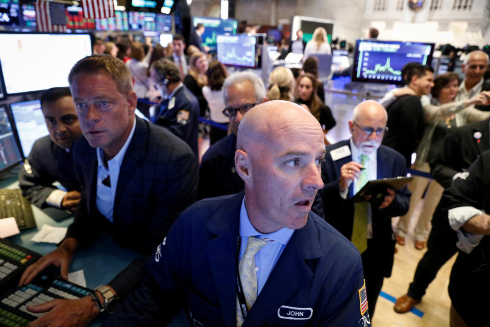Traders work on the floor at the New York Stock Exchange (NYSE) in New York, U.S., July 31, 2019. REUTERS/Brendan McDermid