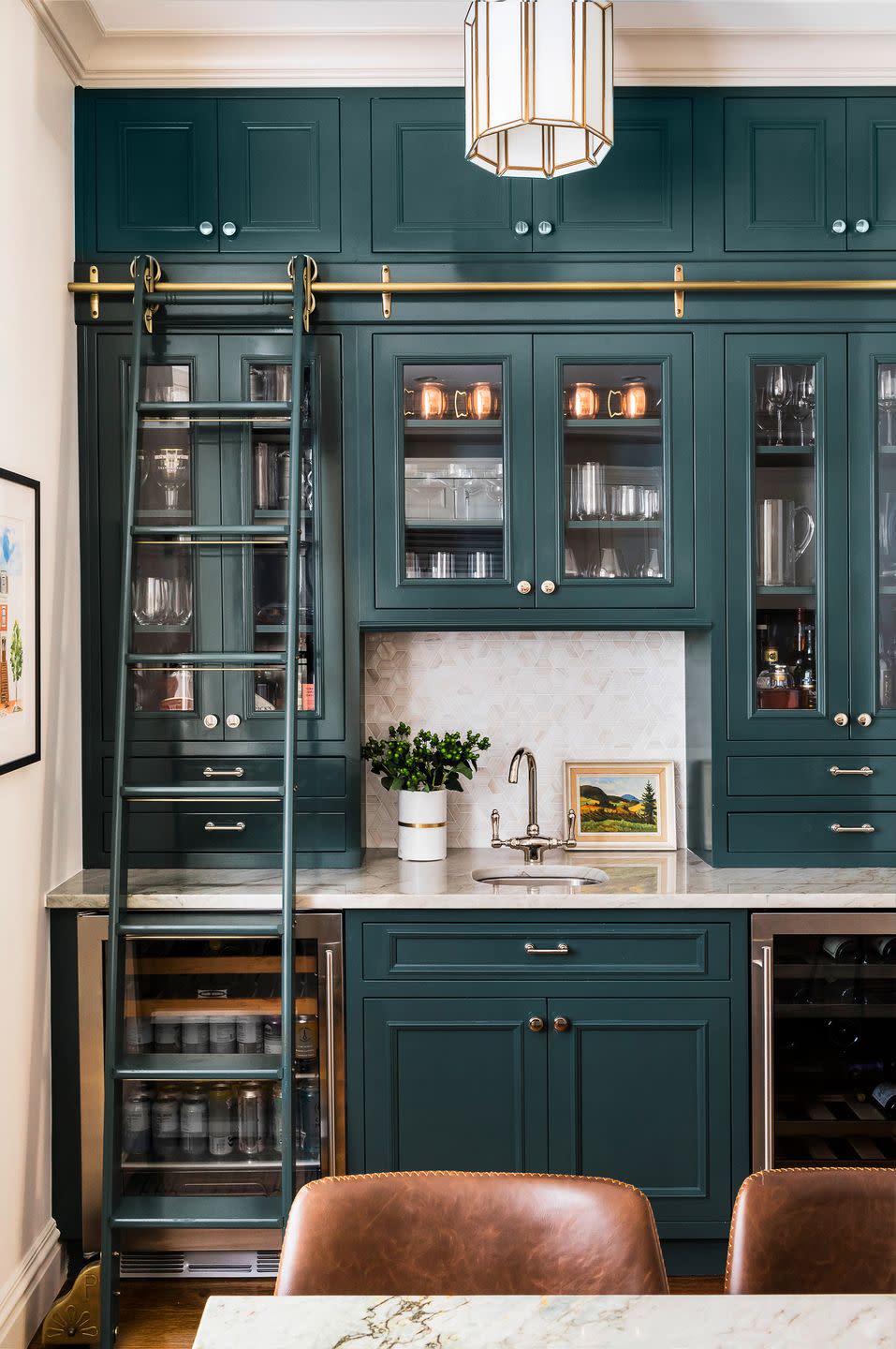 a kitchen with blue cabinets