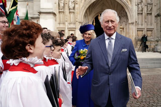 <p>JORDAN PETTITT/POOL/AFP via Getty</p> King Charles and Queen Camilla meet with choristers following the Commonwealth Day service ceremony, at Westminster Abbey, in London, in March 2023.