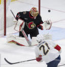 Florida Panthers center Nick Cousins fires the puck wide of the net past Ottawa Senators goaltender Anton Forsberg during the second period of an NHL hockey game Thursday, April 4, 2024, in Ottawa, Ontario. (Adrian Wyld/The Canadian Press via AP)