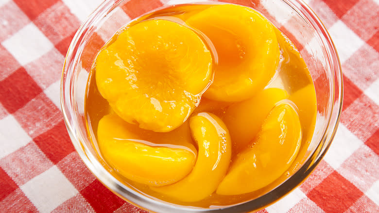 canned peaches in bowl