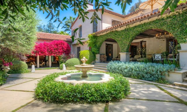 Built in 1927, the Spanish-style mansion includes a guesthouse, courtyard, pavilion, basketball court, tennis court, pool, spa and rose garden.