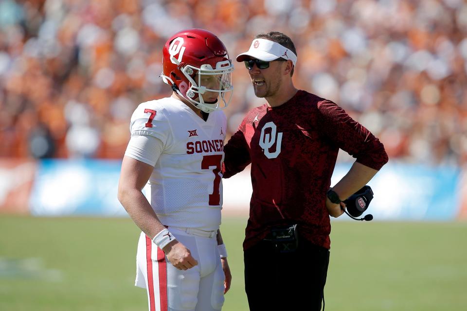 Oklahoma coach Lincoln Riley talks with Oklahoma’s Spencer Rattler (7) before a two point-conversion attempt during the Red River Showdown college football game between the University of Oklahoma Sooners (OU) and the University of Texas (UT) Longhorns at the Cotton Bowl in Dallas, Saturday, Oct. 9, 2021. Oklahoma won 55-48.<br>Ou Vs Texas