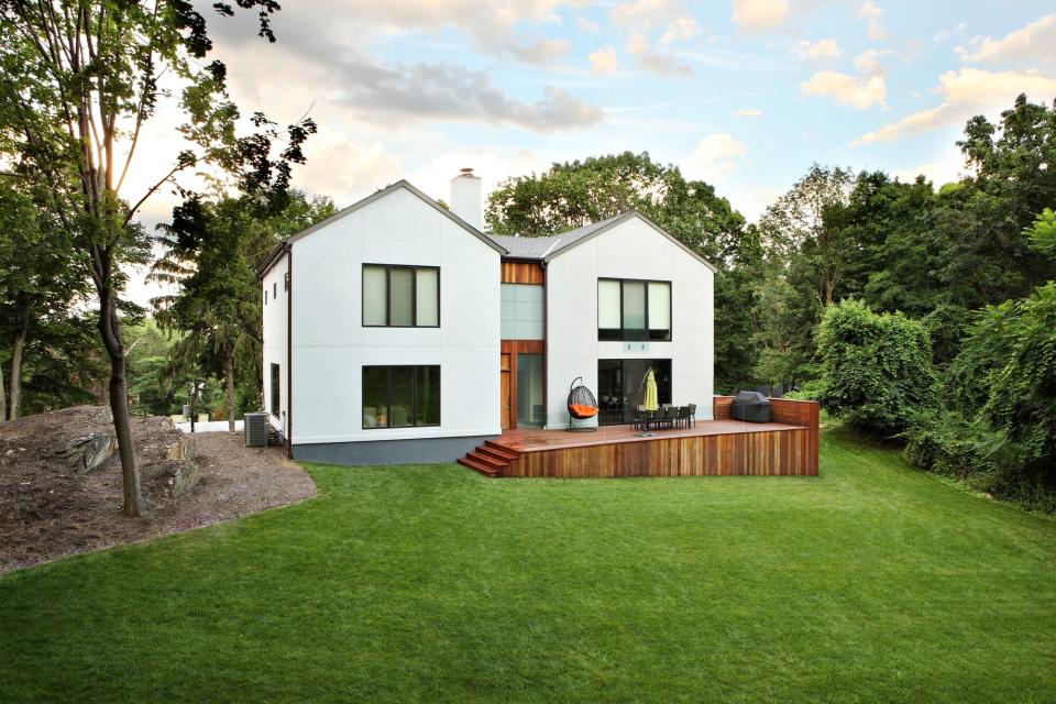 modern home with lush green lawn