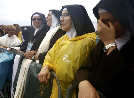 Nuns wait for Pope Francis farewell ceremony at Balice airport near Krakow, Poland July 31, 2016. REUTERS/Kacper Pempel