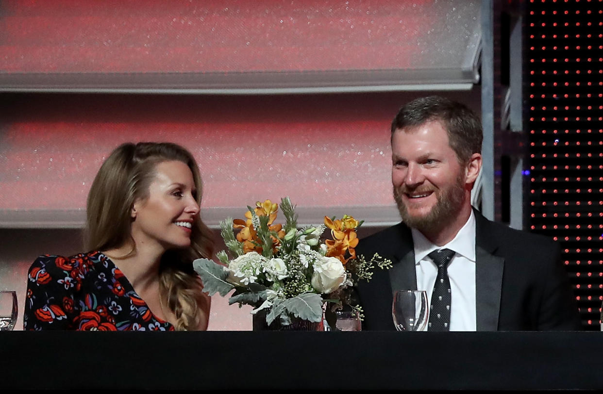 CHARLOTTE, NC - DECEMBER 08:  Dale Earnhardt Jr. sits alongside his wife Amy during the NASCAR XFINITY and Truck Series Banquets at Charlotte Convention Center on December 8, 2018 in Charlotte, North Carolina.  (Photo by Streeter Lecka/Getty Images)