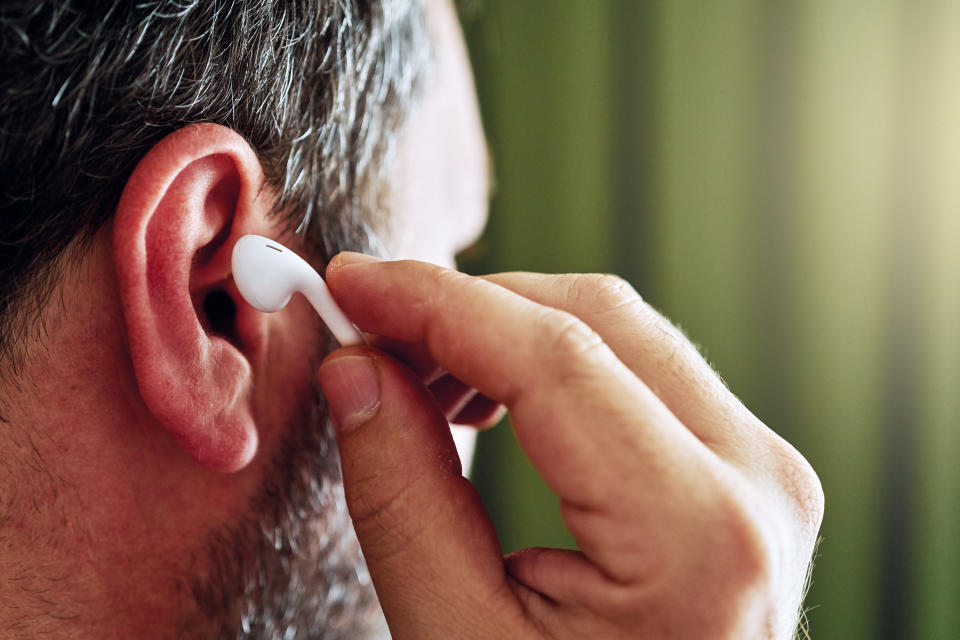 Man using headphones.