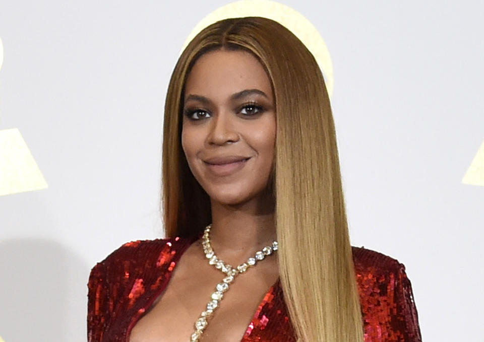 FILE - In this Feb. 12, 2017 file photo, Beyonce poses in the press room at the 59th annual Grammy Awards in Los Angeles. The pop star scored multiple Grammy nominations Tuesday, making her the leading contender with nine nominations. (Photo by Chris Pizzello/Invision/AP, File)