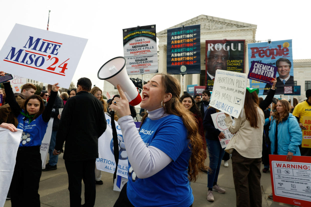 Protesters outside the Supreme Court as justices hear oral arguments in a bid to preserve broad access to the abortion pill