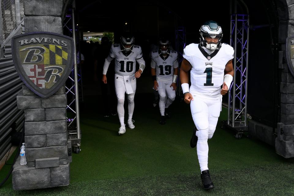 Philadelphia Eagles quarterback Jalen Hurts (1) walks onto the field in front of quarterbacks Tanner McKee (10) and Ian Book (19) before an NFL preseason football game against the Baltimore Ravens in Baltimore, Saturday, Aug. 12, 2023.