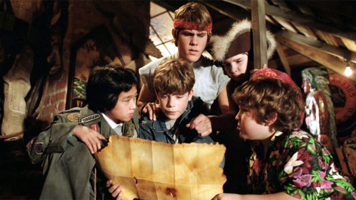 Kids look at a map in The Goonies.