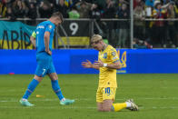 Ukraine's Mykhailo Mudryk, right, celebrates at the end of the Euro 2024 qualifying play-off soccer match between Ukraine and Iceland, at the Tarczynski Arena Wroclaw in Wroclaw, Poland, Tuesday, March 26, 2024. (AP Photo/Czarek Sokolowski)