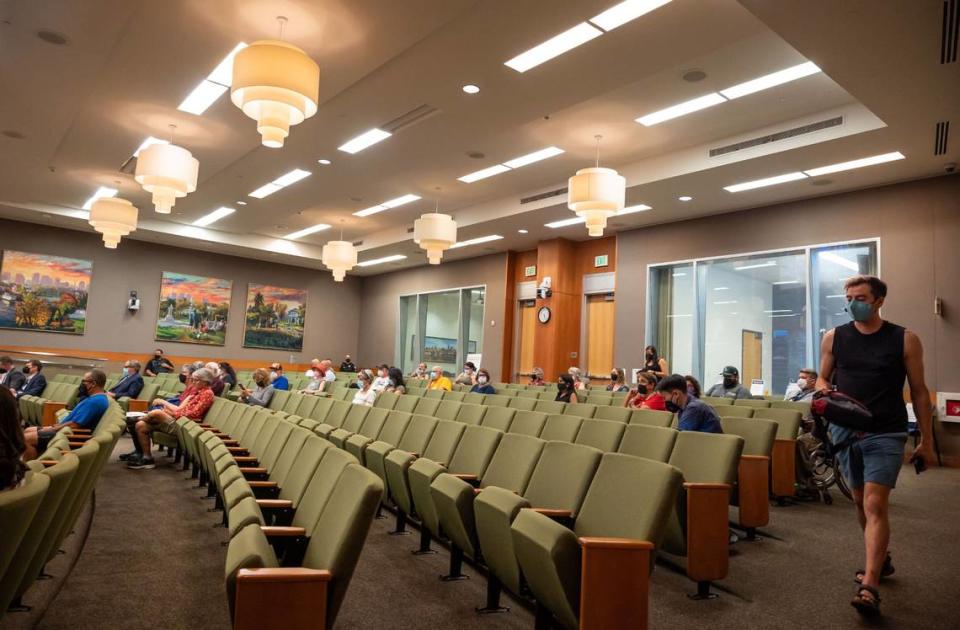 Voters and members of the public take their seats immediately before the Sacramento City Council agenda begins Tuesday, the first meeting back open to public attendance at City Hall since the beginning of the COVID-19 pandemic.