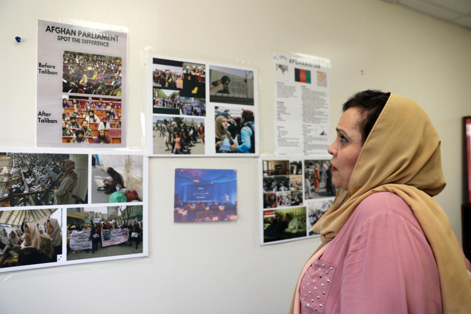 Roshan Mashal put photos of women in Afghanistan on the walls of her office at the University of Texas at Arlington. They are reminders of the ongoing struggle back home, she said. (Kenzi Abou-Sabe / NBC News)