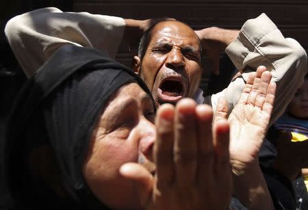 Relatives and families of members of the Muslim Brotherhood and supporters of ousted Egyptian President Mohamed Mursi react outside a court in Minya, south of Cairo, after the sentences of Muslim Brotherhood leader Mohamed Badie and his supporters were announced, June 21, 2014. REUTERS/Mohamed Abd El Ghany